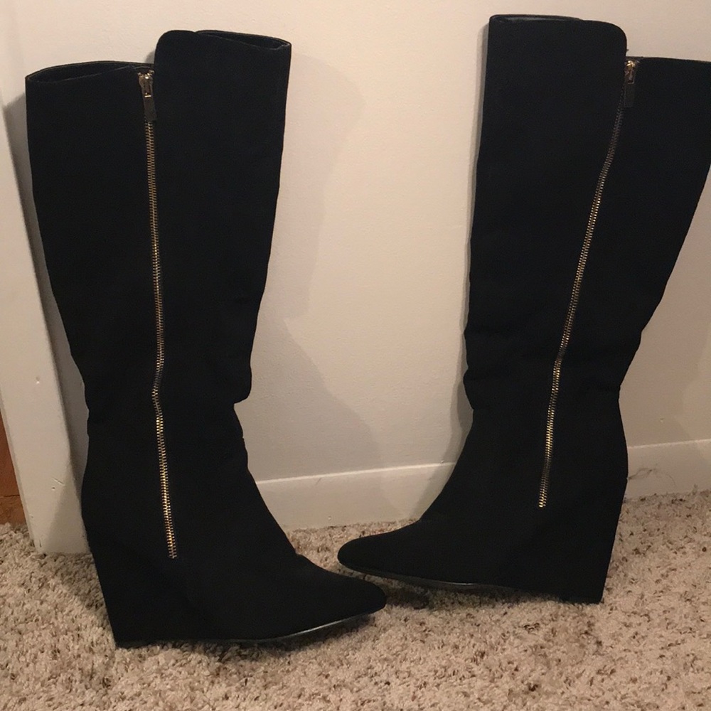 Classy black wedge boot with gold accent zipper.